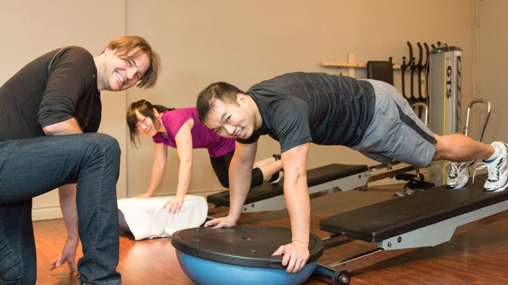 Healthier Future with Best Workout Classes Vancouver, Troy hands-on with his clients.