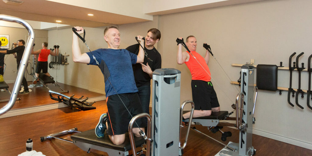 Maximize Your Exercise in Vancouver Using Total Gym. Troy with his clients.