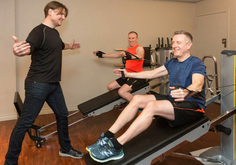 Why Enroll in Fitness Classes in Vancouver? Troy with two of his clients.